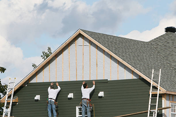 Professional Siding technician working in Plano, TX